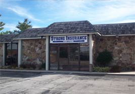 The Strong Insurance Services office, a fieldstone building in Crossville, Tennessee